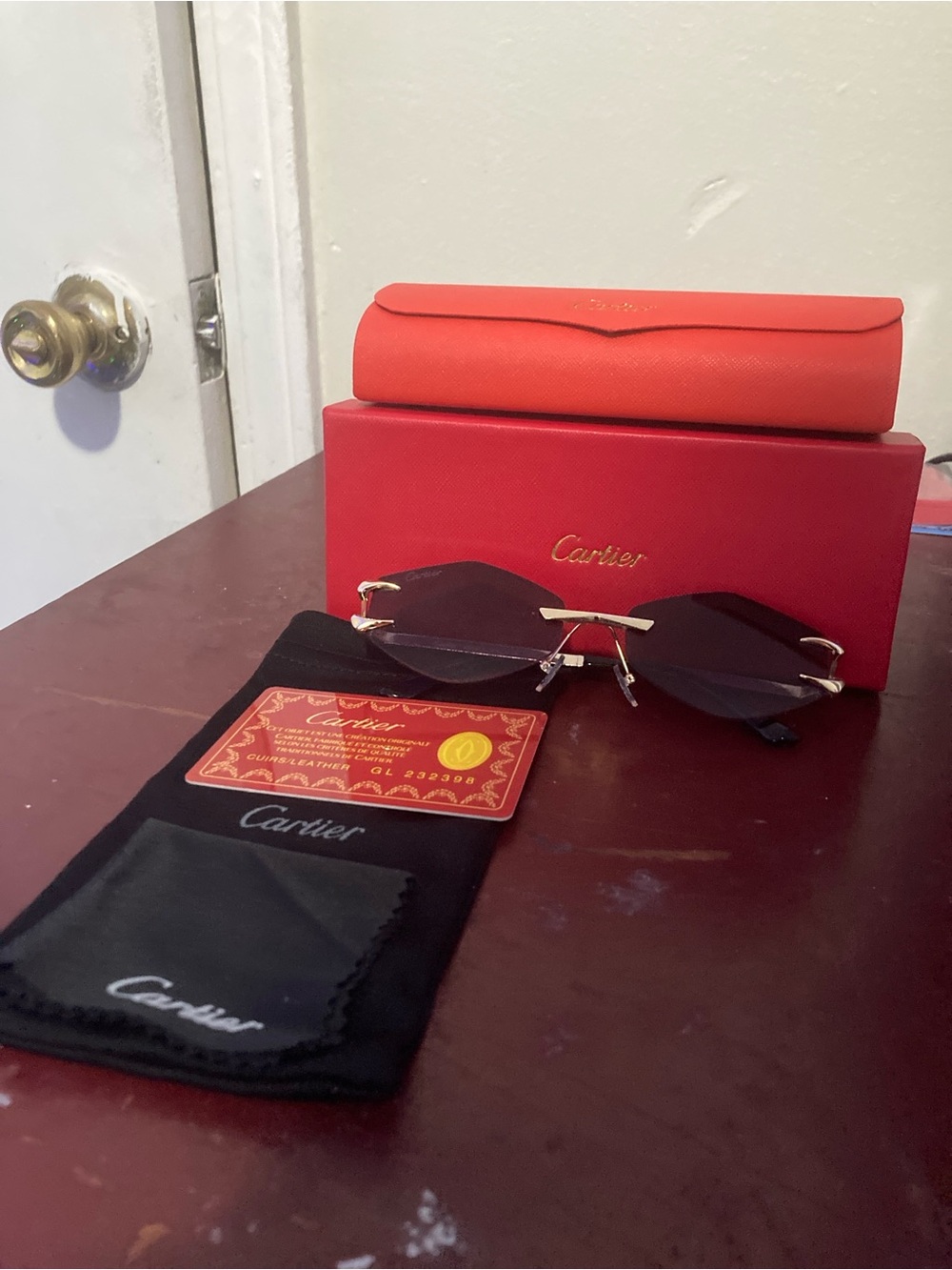 Cartier Men’s Rimless Sunglasses in Black Lenses with Gold Accents